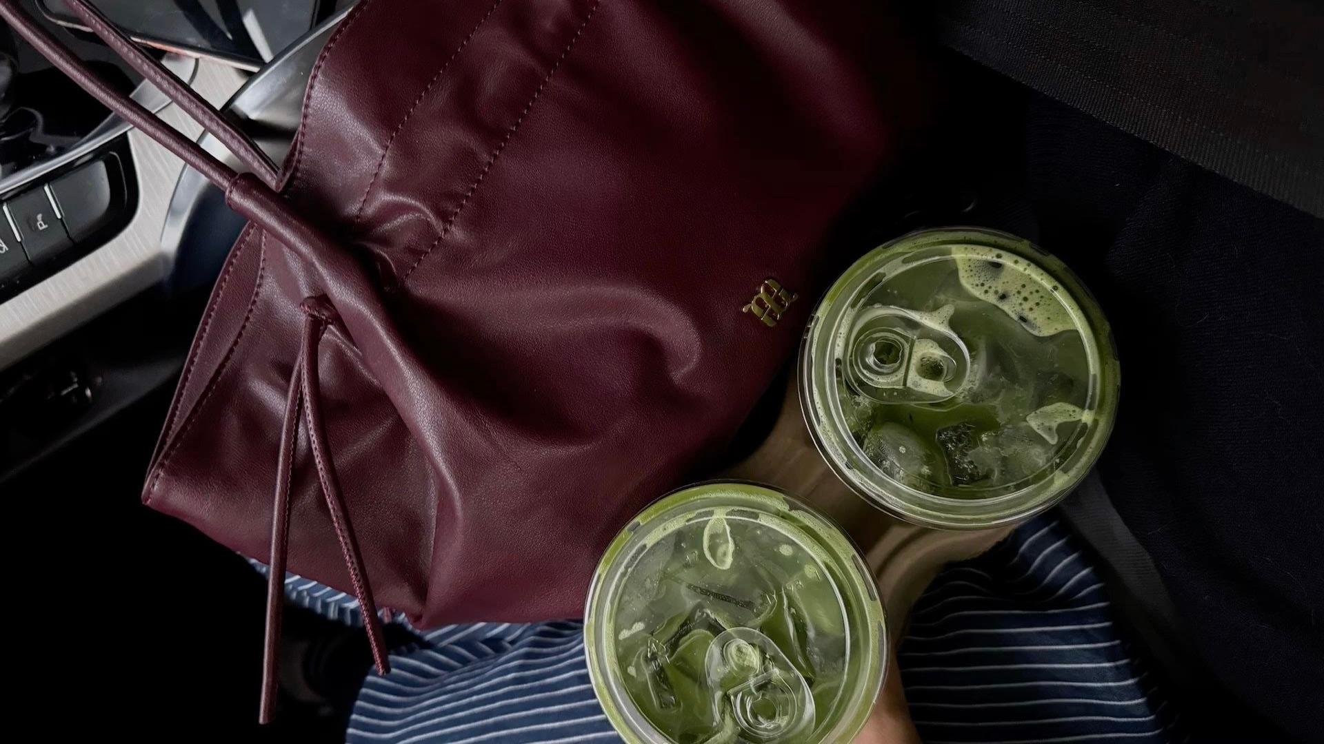 Burgundy bag with 2 cups of green matcha
